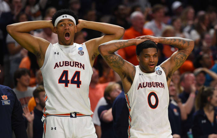 Mar 18, 2022; Greenville, SC, USA; Auburn Tigers center Dylan Cardwell (44) and Auburn Tigers guard K.D. Johnson (0) react against the Jackson State Tigers during the first round of the 2022 NCAA Tournament at Bon Secours Wellness Arena. Mandatory Credit: Bob Donnan-USA TODAY Sports